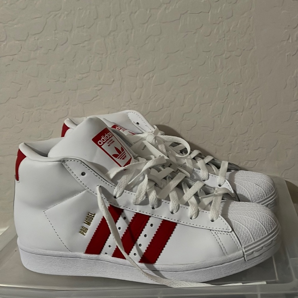 Adidas Hi top white shoes. Brand new. Unisex. Size 7.5